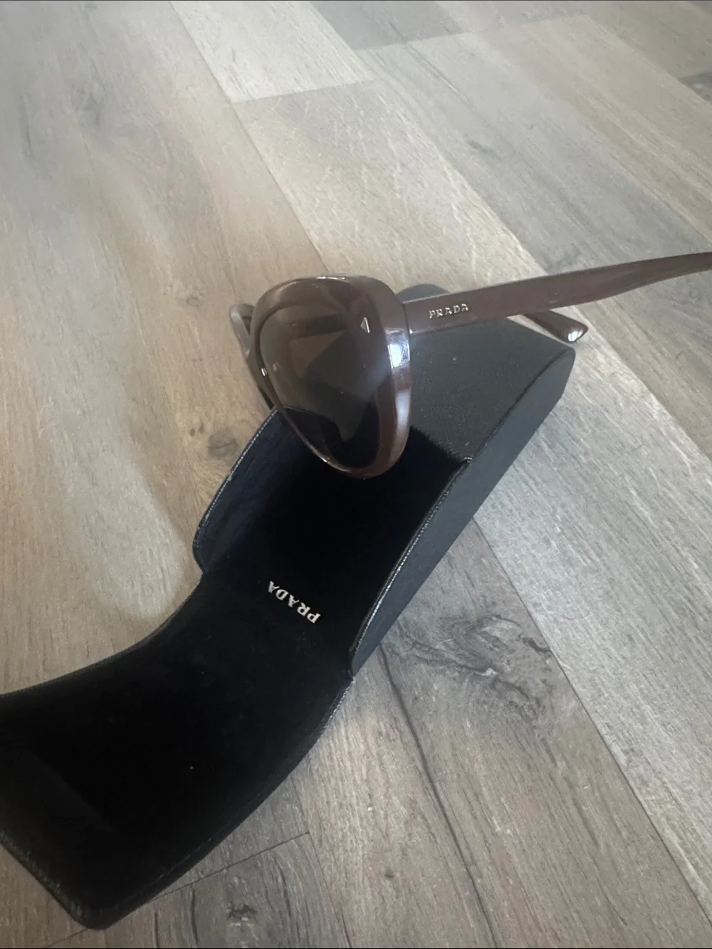 Prada Brown Women's Oval Sunglasses with Dark Brown Lenses